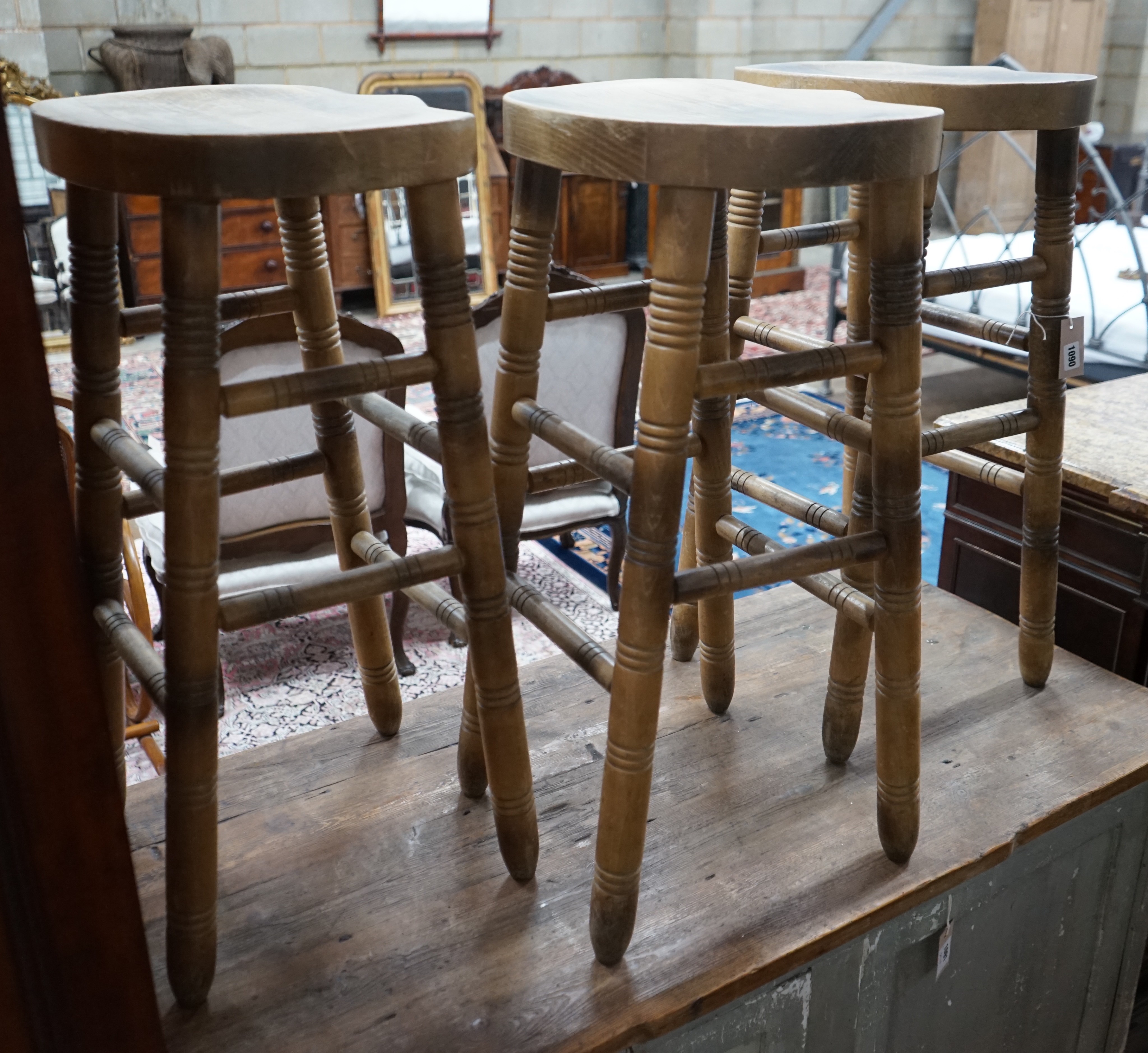 Three turned beech bar stools, height 77cm